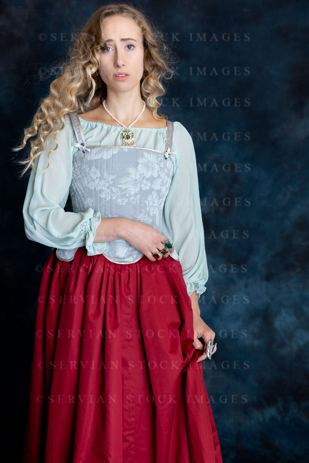 Renaissance or Tudor woman in a brocade corset, and red skirt (Kat 2911)