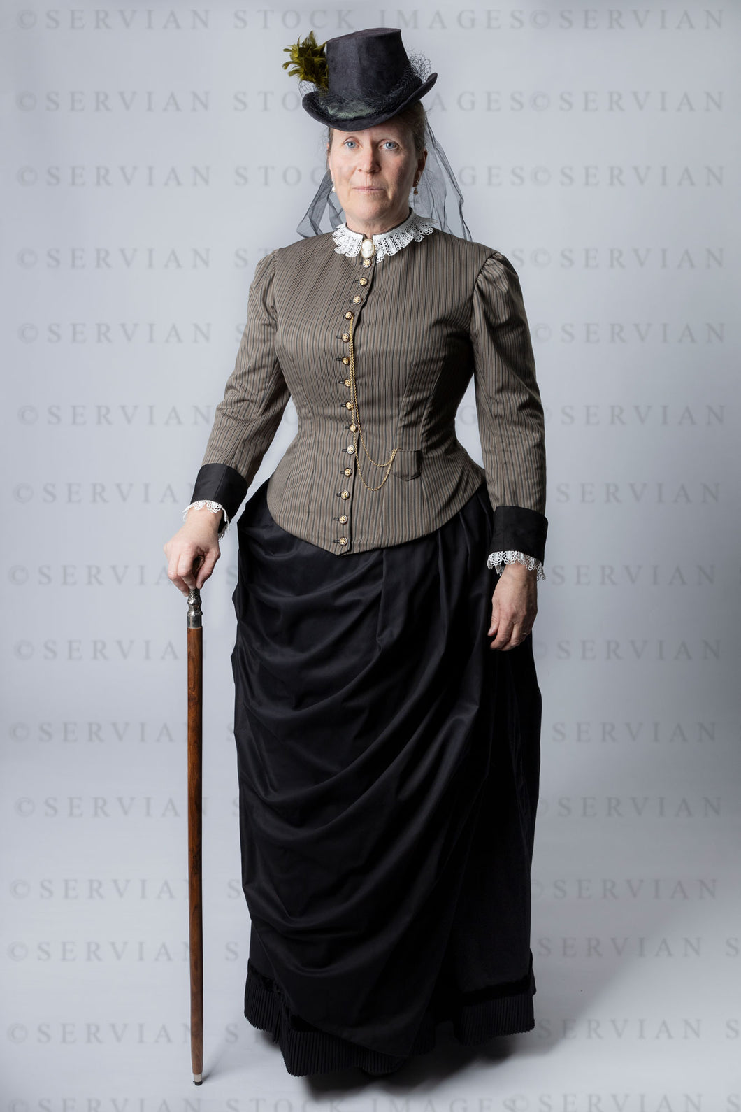 Victorian woman wearing a cuirass bodice and bustle skirt (Tracey 2921)