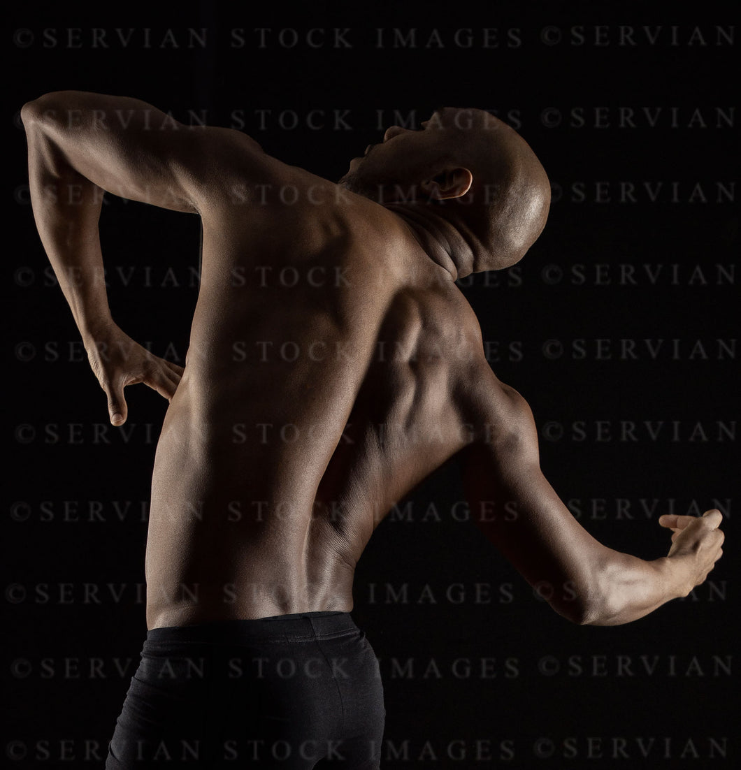 Male dancer against a black backdrop  (Otis 3717)