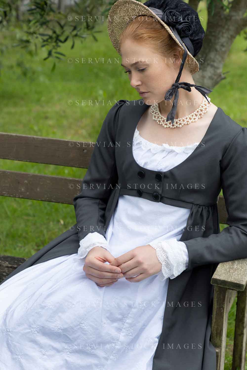 Regency woman in white muslin dress, spencer and bonnet sitting on a bench (Lauren 4566)
