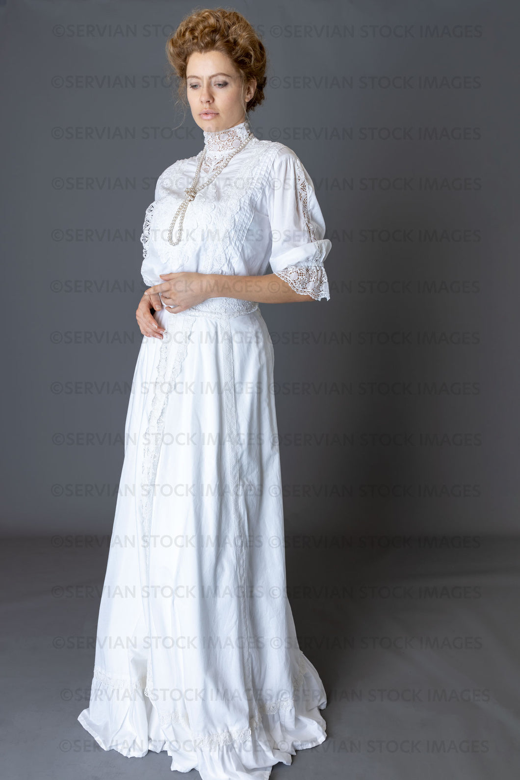 Edwardian woman in a white lace blouse and skirt with a pearl necklace (Anastasiya 4782)
