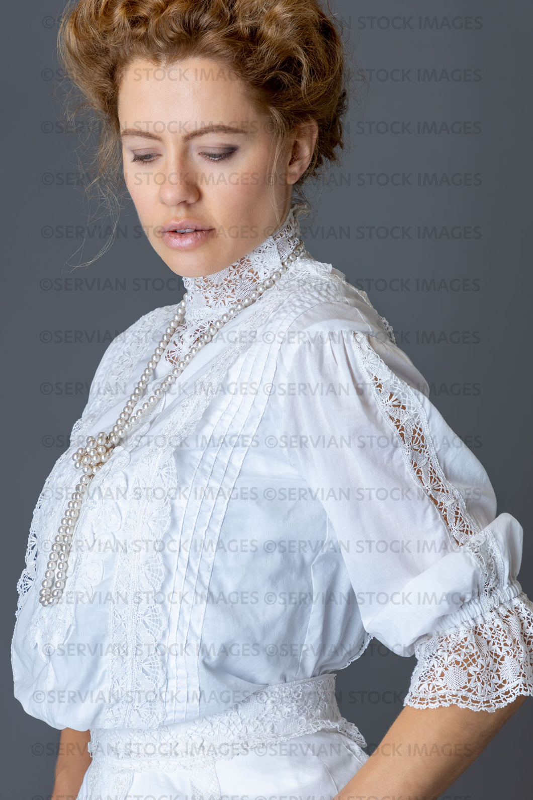 Edwardian woman in a white lace blouse and skirt with a pearl necklace (Anastasiya 4792)