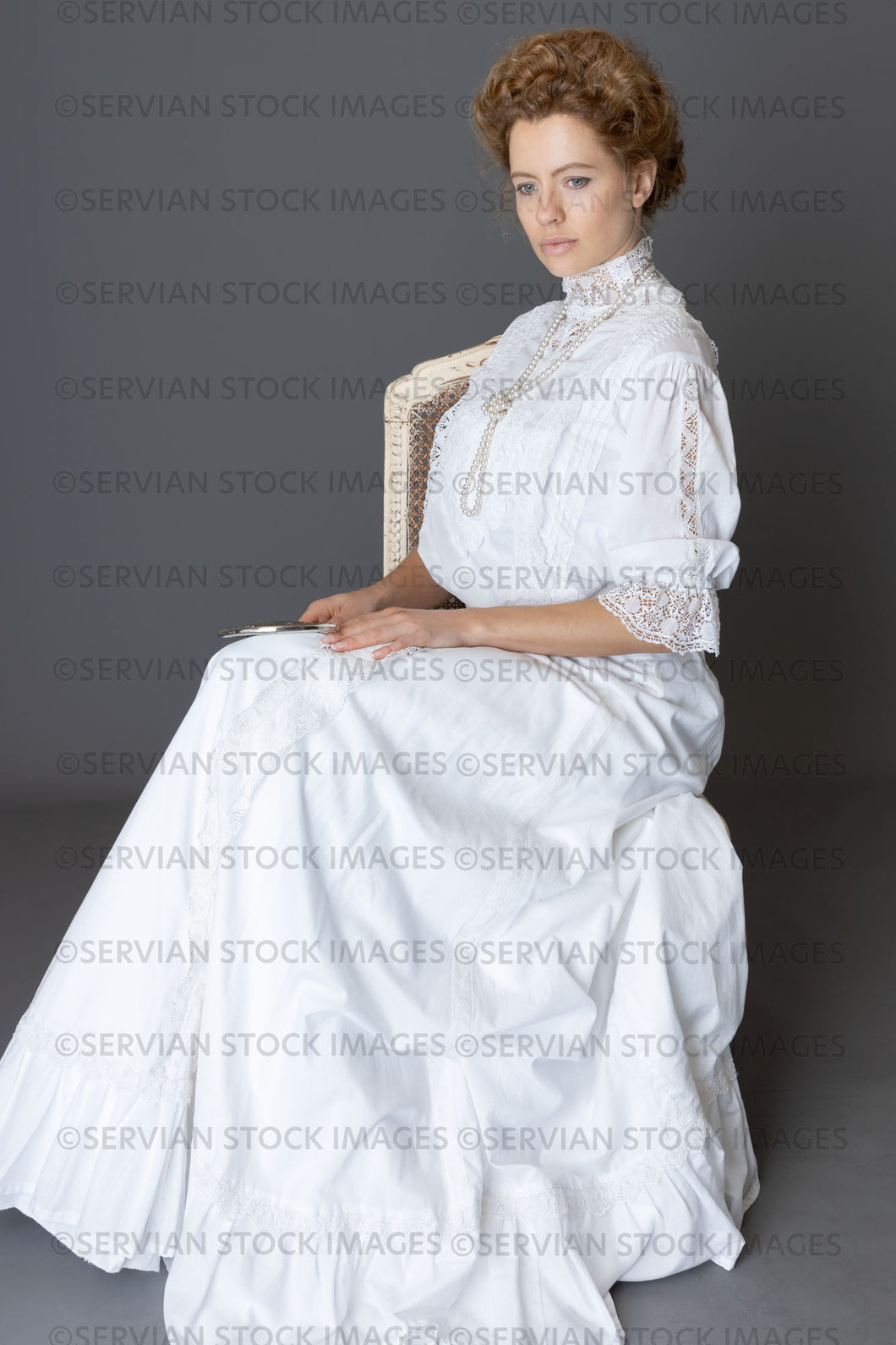 Edwardian woman in a white lace blouse and skirt with a pearl necklace (Anastasiya 4869)