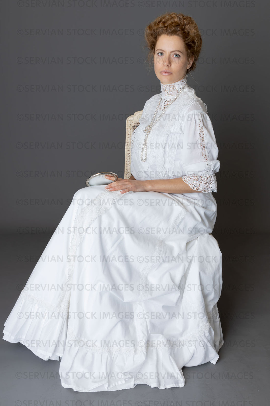 Edwardian woman in a white lace blouse and skirt with a pearl necklace (Anastasiya 4870)