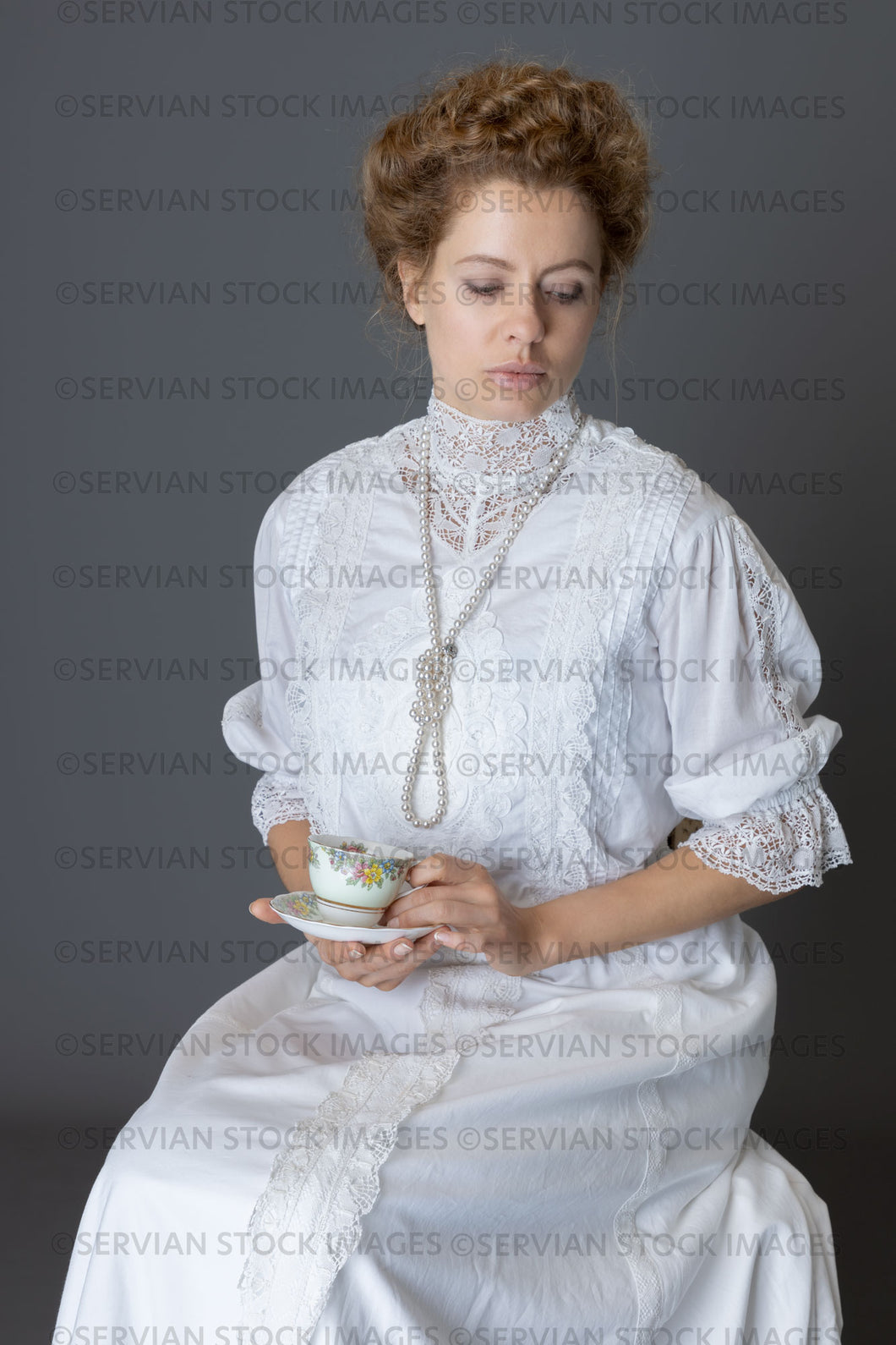 Edwardian woman in a white lace blouse and skirt with a pearl necklace  (Anastasiya 4918)