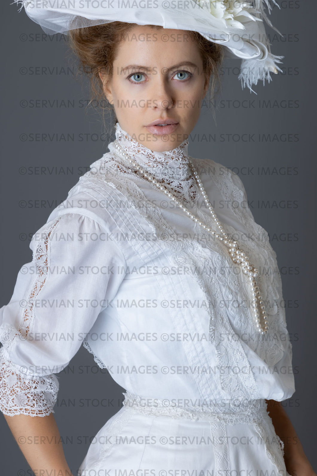 Edwardian woman in a white lace blouse and skirt with a pearl necklace (Anastasiya 4948)