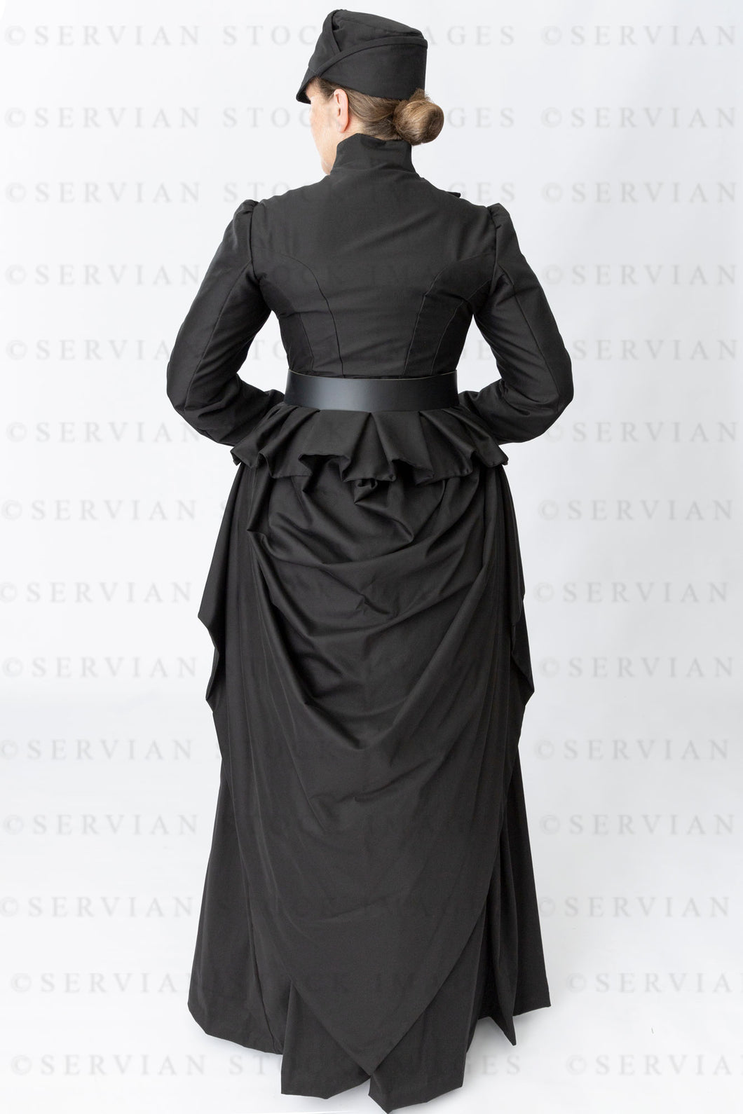 Victorian woman in a black bustle ensemble (Tracey 5034)