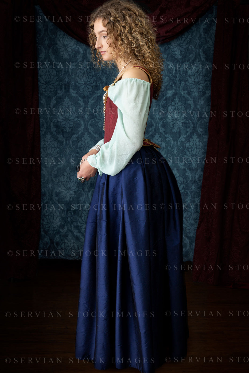 Renaissance or Georgian woman in a red brocade corset and blue silk skirt (Sav 5226)