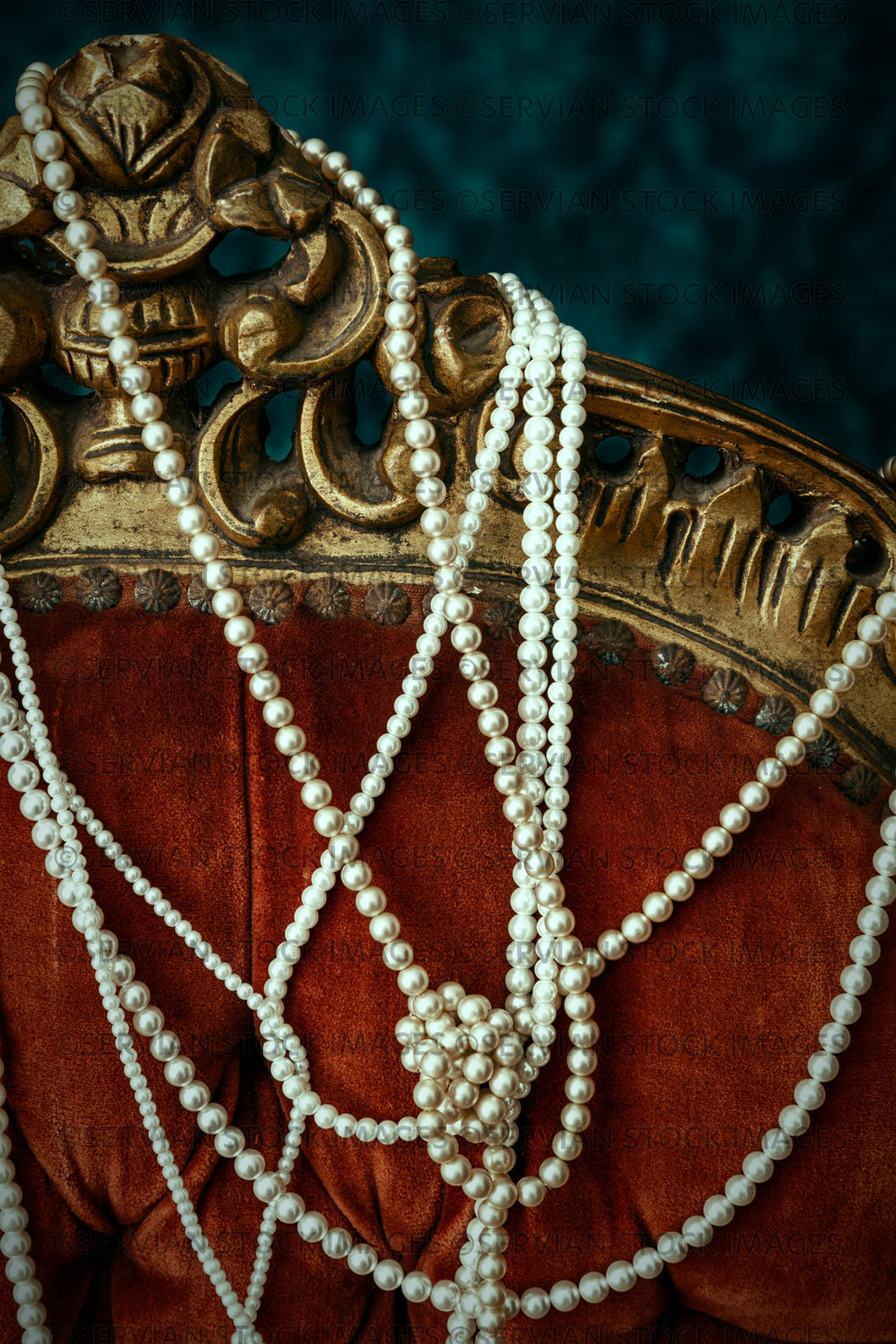 Still life -   Strings of pearls draped over a vintage chair (KS 5361)