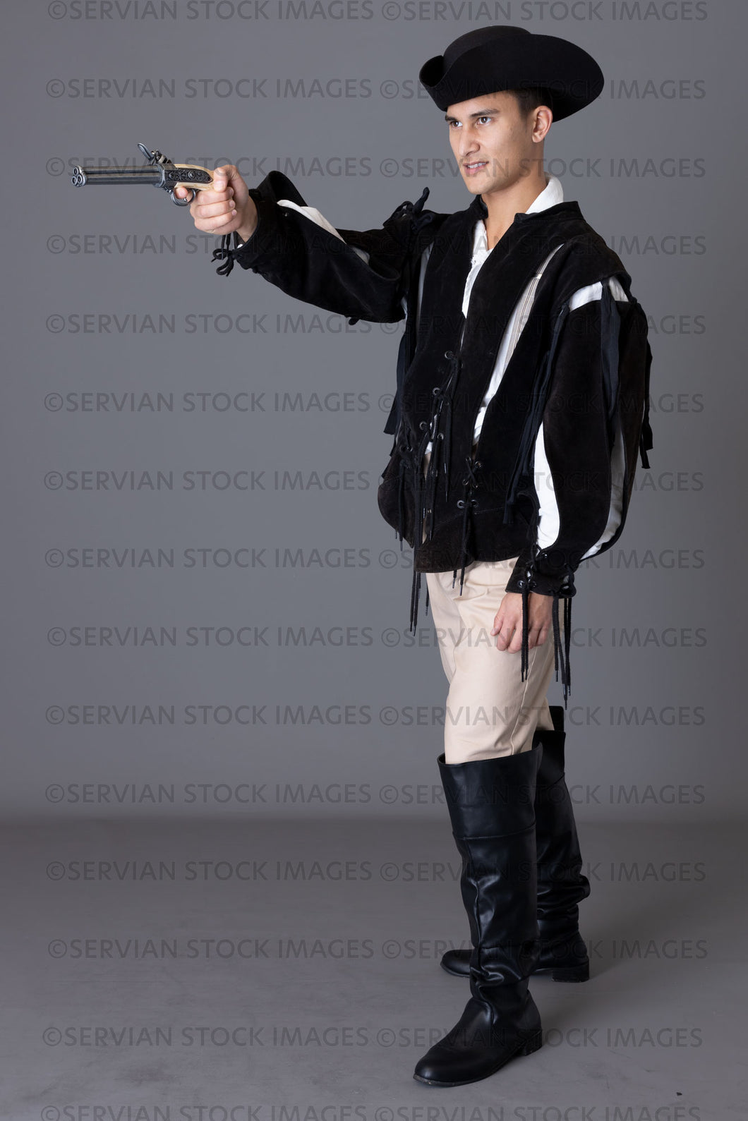 Pirate man holding a pistol against a grey backdrop (Lukas 5965)