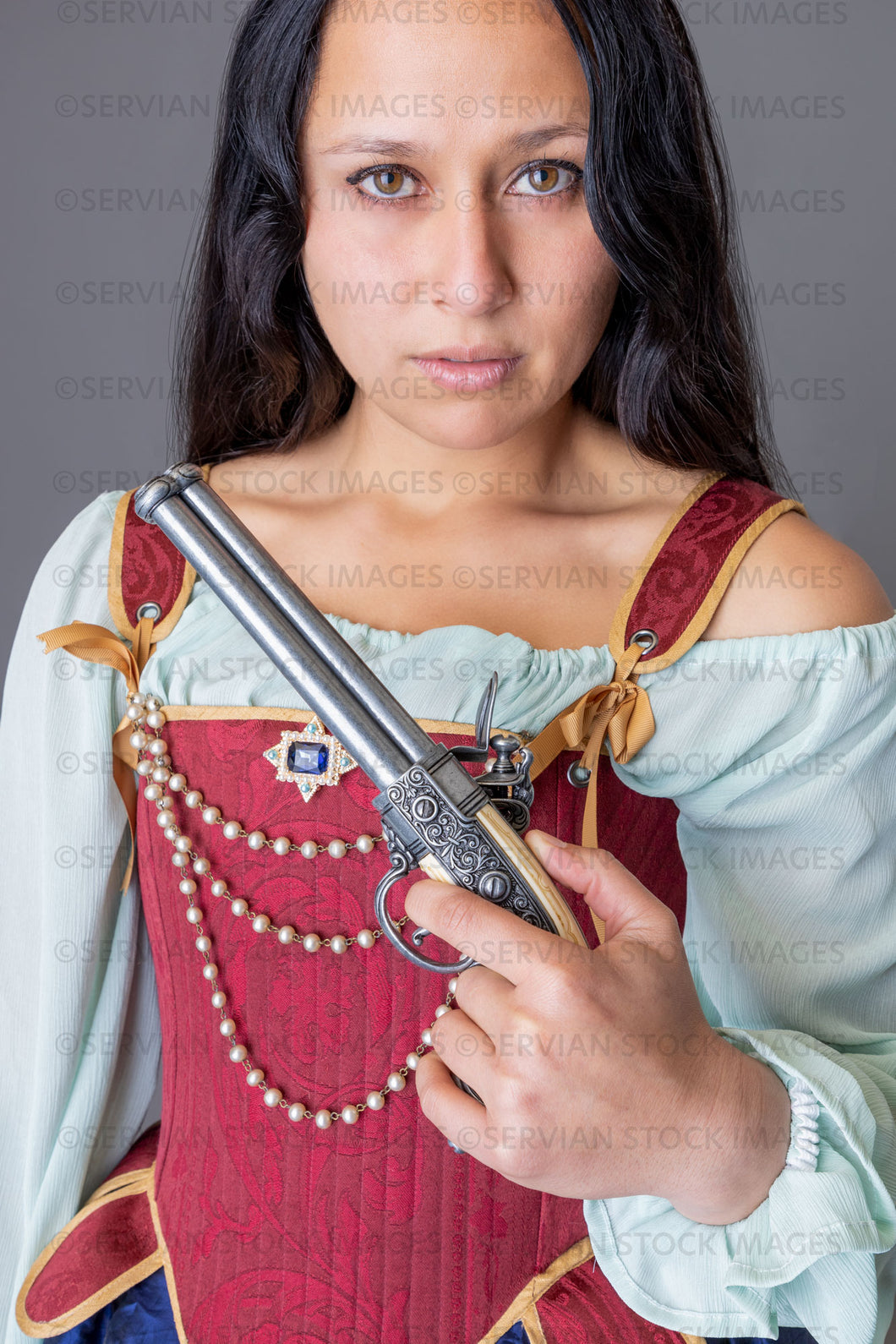 Pirate woman holding a weapon against a grey backdrop (Sylvia 6053)