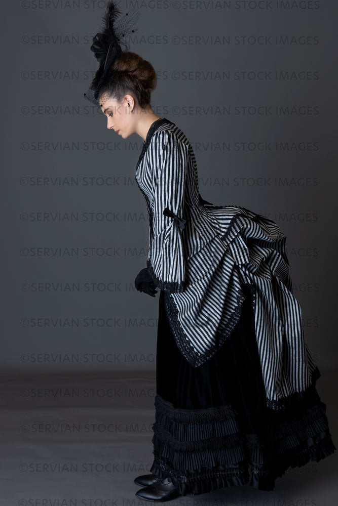 Victorian woman in a striped silk 1870s bustle ensemble  (Sarah 8804)