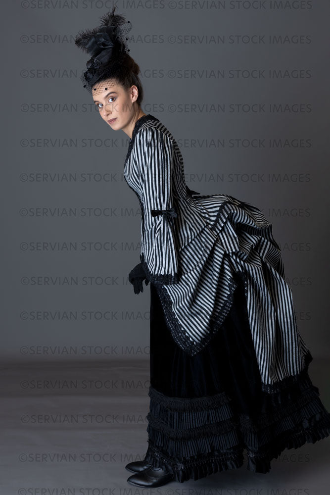 Victorian woman in a striped silk 1870s bustle ensemble  (Sarah 8806)