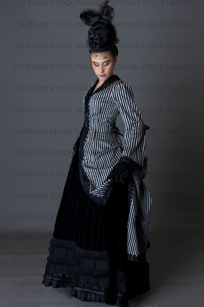 Victorian woman in a striped silk 1870s bustle ensemble  (Sarah 8811)