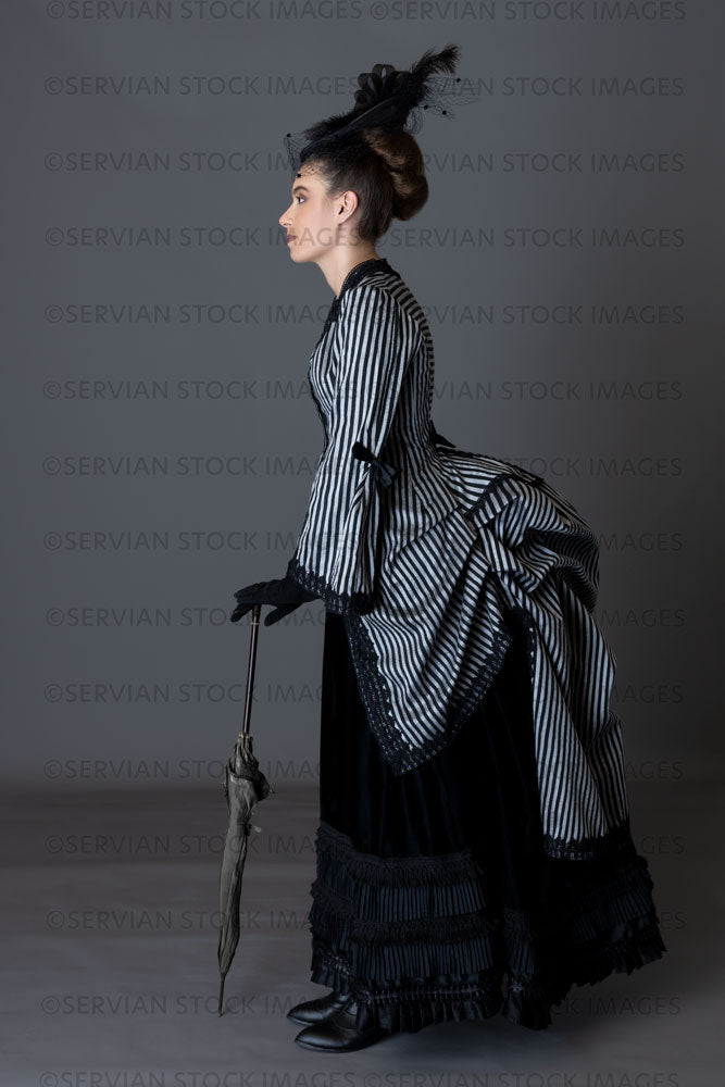 Victorian woman in a striped silk 1870s bustle ensemble  (Sarah 8840)