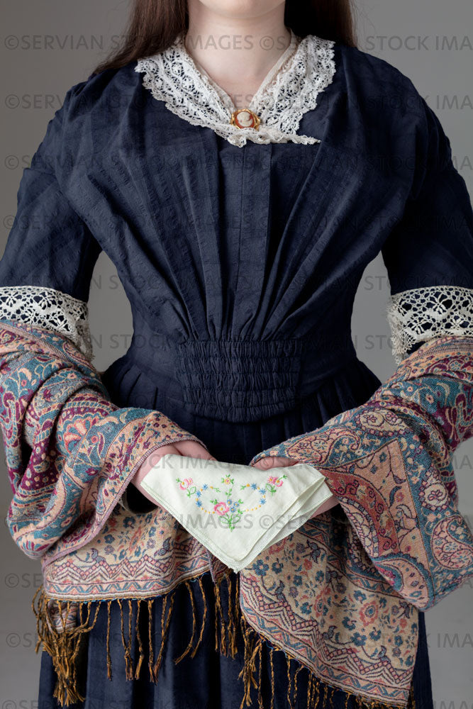Young Victorian woman wearing a grey/blue cotton dress with antique lace trim (Kate 9656)