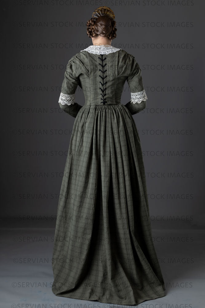 Victorian working class woman in dark green bodice and skirt (Sarah 1145)