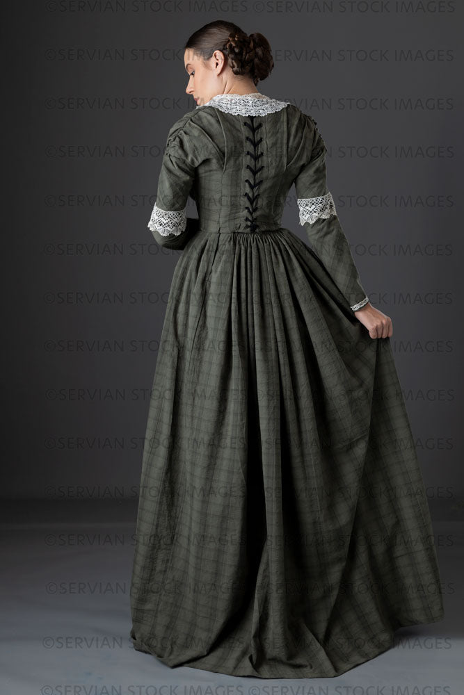 Victorian working class woman in dark green bodice and skirt (Sarah 1149)