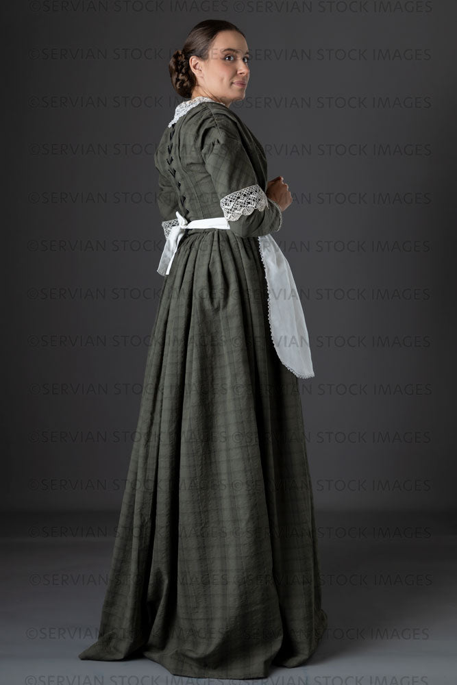 Victorian working class woman in dark green bodice and skirt (Sarah 1160)