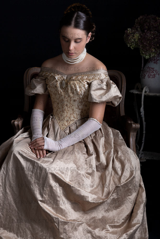 Victorian woman wearing a gold ball gown and long lace gloves (Sarah 1271)