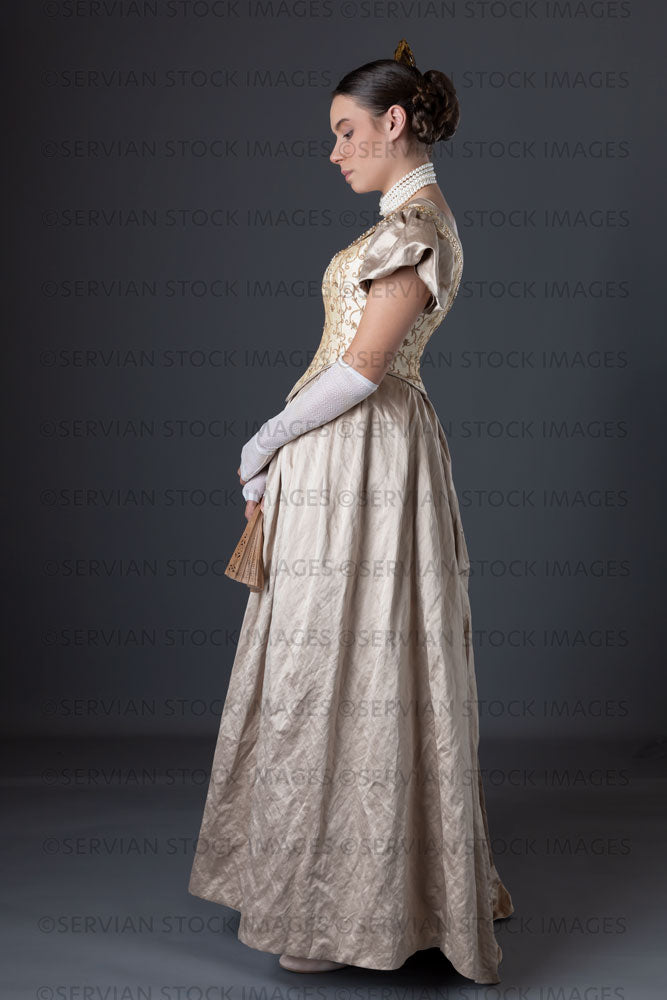 Victorian woman wearing a gold ball gown  (Sarah 1303)