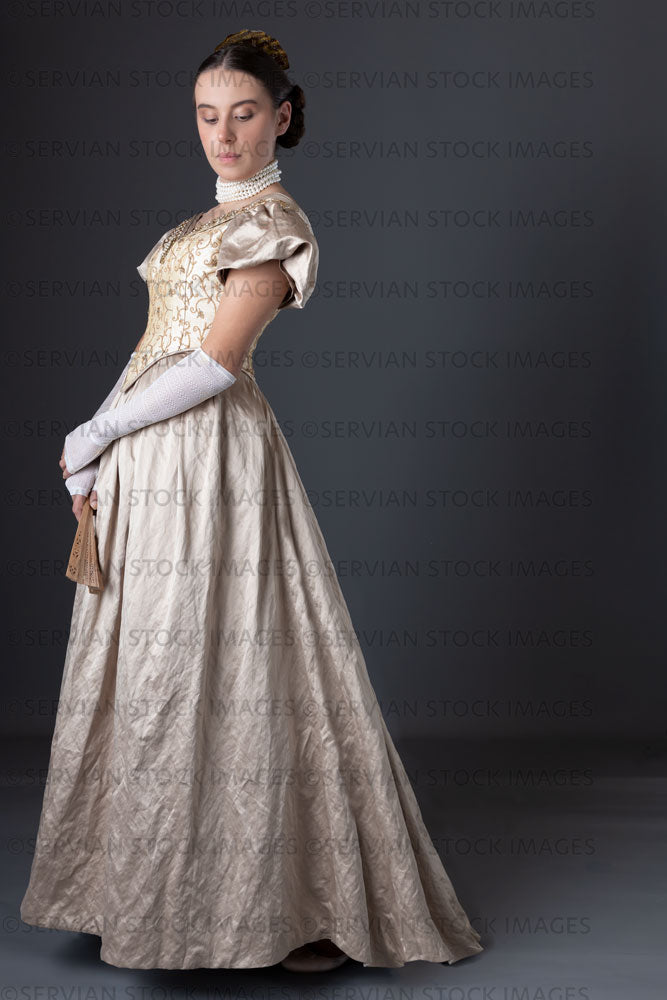 Victorian woman wearing a gold ball gown  (Sarah 1305)