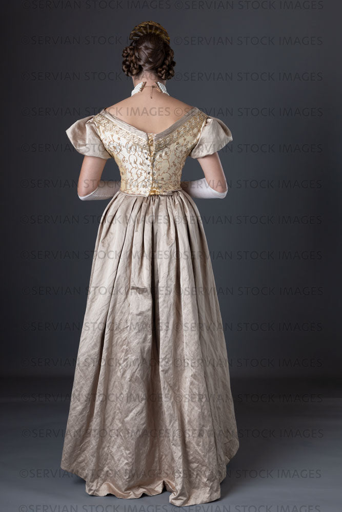 Victorian woman wearing a gold ball gown  (Sarah 1306)