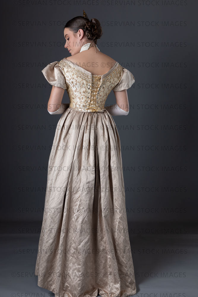 Victorian woman wearing a gold ball gown  (Sarah 1308)