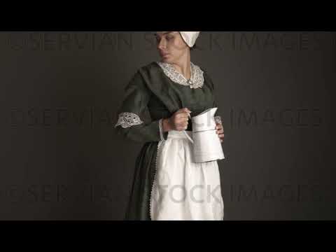 Victorian maid servant wearing a dark green check bodice and skirt carries a  jug   (Sarah 1725)