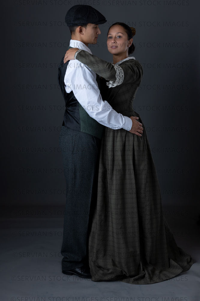 Working class Victorian couple against a grey backdrop (Sylvia and Lukas 1457)