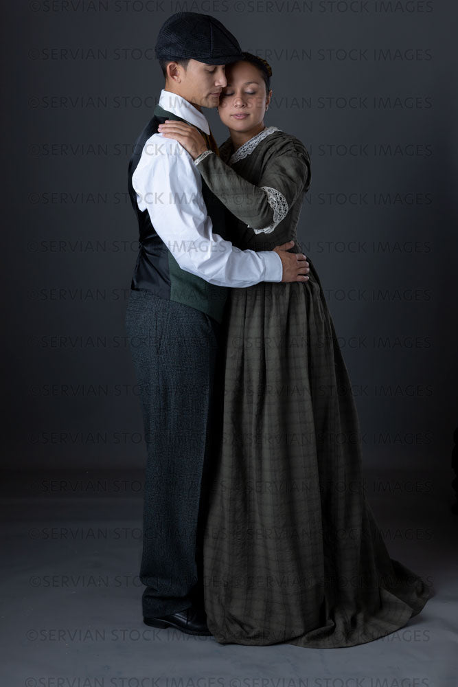 Working class Victorian couple against a grey backdrop (Sylvia and Lukas 1460)