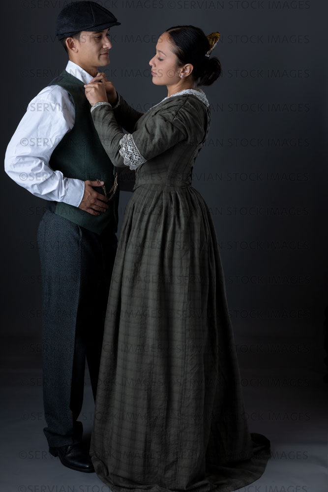 Working class Victorian couple against a grey backdrop (Sylvia and Lukas 1472)