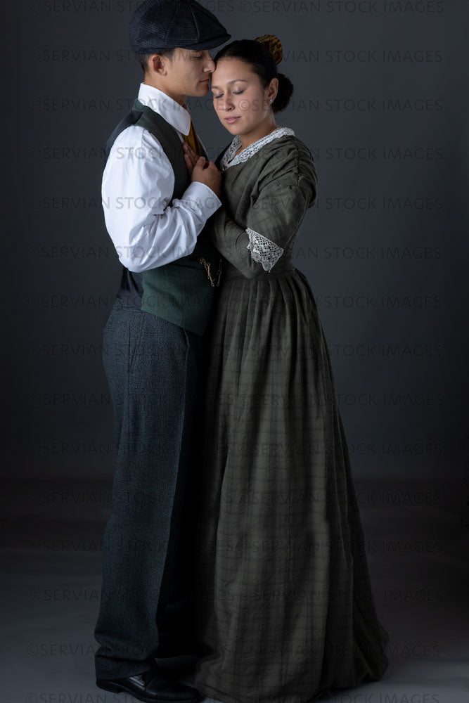 Working class Victorian couple against a grey backdrop (Sylvia and Lukas 1484)